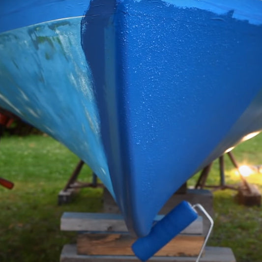 JD Select Water-Based Bottom Paint blue being rolled on a boat